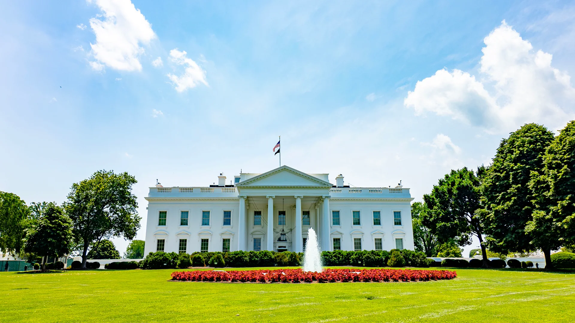 White House East Wing construction fencing and cranes seen from a public sidewalk after the John Roberts White House ballroom ruling